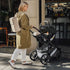 Romer Juni Infant Car Seat with Versa Base, SecureLoc Technology, Luxury Cover, Peppercorn